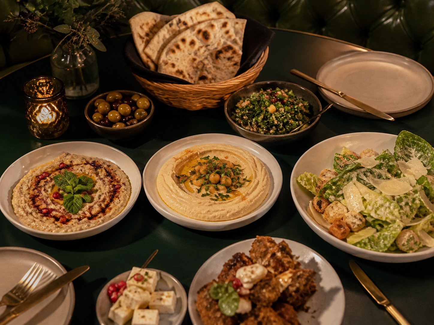 Jordanian-inspired mezze with hummus, mutabbal, salad and warm flatbread